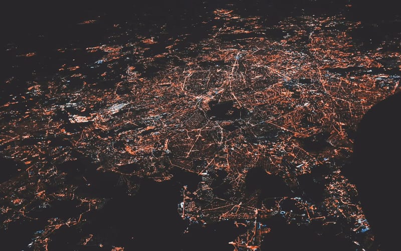 Aerial view of a city grid lit at night