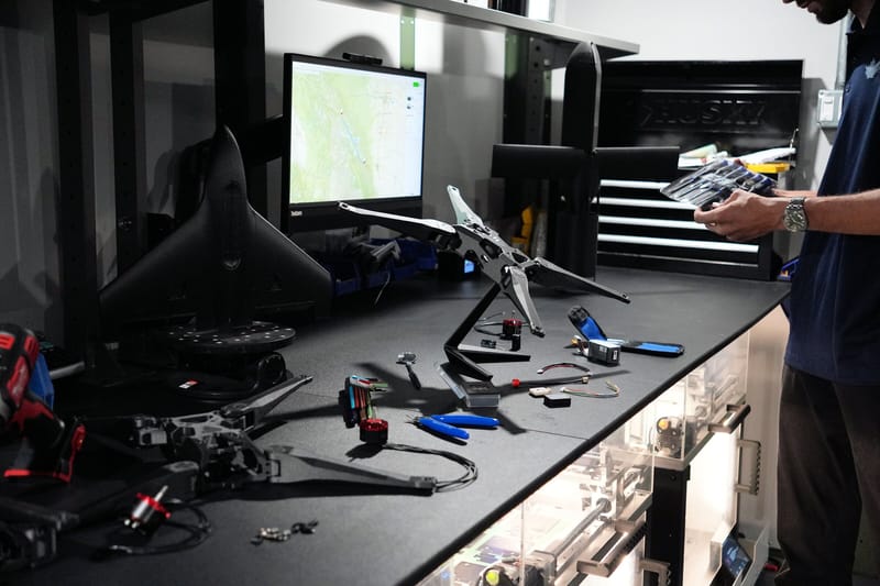 Unmanned aircraft and tools laid out on a workbench