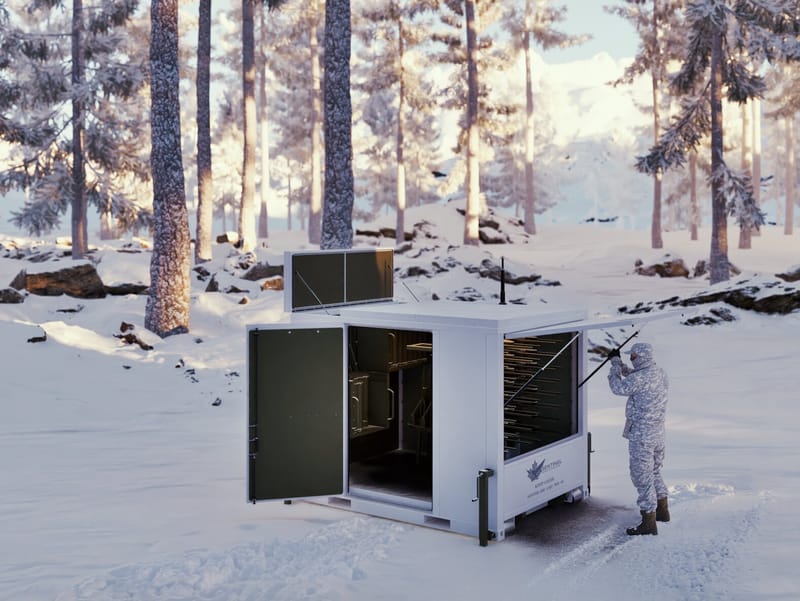 LARS unit deployed in snow with an operator at the open magazine